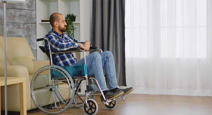 a disabled man in a wheel chair waiting to get disability insurance